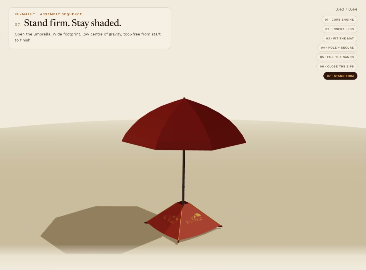 Kū-Malu stabiliser fully assembled in the sand with the umbrella open